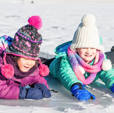 Children enjoying a natural ice skating rink