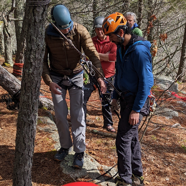 AMC Narragansett Instructors teaching students intermediate rock climbing skills
